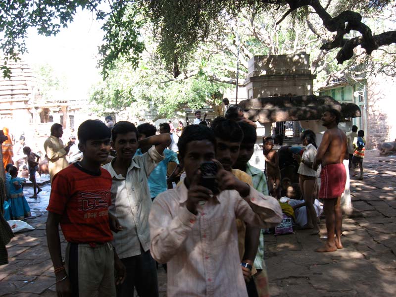 Here, I was sick of it. I took a picture of them taking a picture of me. This was the last temple we went to in the country. Not in Hampi.